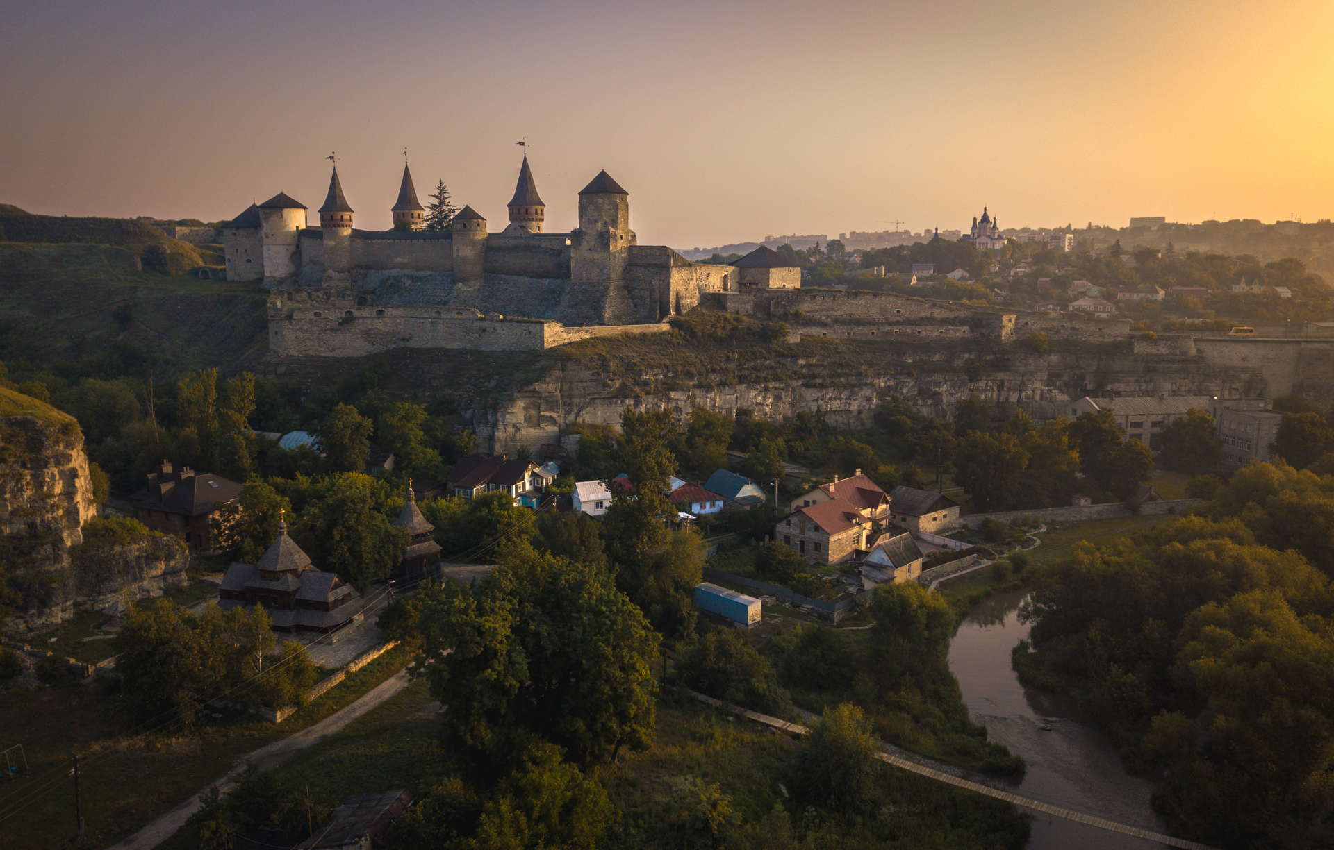 Kamianets-Podilskyi Castle, Kamianets-Podilskyi Castle sunset, Kamianets-Podilskyi Castle backpacking, Kamianets-Podilskyi Castle best photo, Kamianets-Podilskyi Castle tent, Kamianets-Podilskyi Castle wild camping, Kamianets-Podilskyi, ukraine wild camping, ukraine travel, ukraine backpacker, seven wonders of ukraine, shorts-trip, sunrise at Kamianets podilski, kamenets podolski, where to camp at Kamianets podolskij, free camping at kamianets-podilskyi, best sunset picture, sunset over Kamianets-Podilskyi Castle, Kamianets-Podilskyi Castle drone, aerial view of Kamianets-Podilskyi