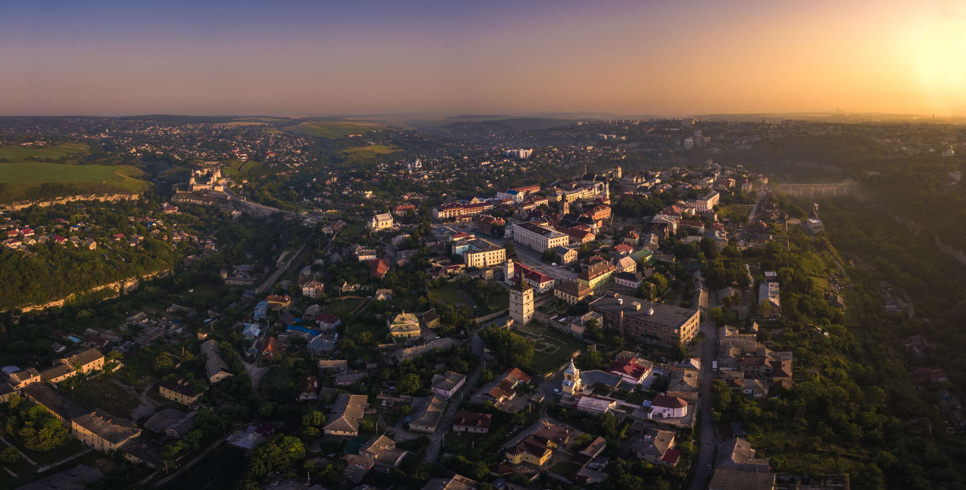 Kamianets-Podilskyi Castle, Kamianets-Podilskyi Castle sunset, Kamianets-Podilskyi Castle backpacking, Kamianets-Podilskyi Castle best photo, Kamianets-Podilskyi Castle tent, Kamianets-Podilskyi Castle wild camping, Kamianets-Podilskyi, best sunset picture, sunset over castle, sunset ukraine, ukraine wild camping, ukraine travel, ukraine backpacker, seven wonders of ukraine, shorts-trip, sunrise at Kamianets podilski, kamenets podolski, Kamianets-Podilskyi Castle drone, aerial view of Kamianets-Podilskyi